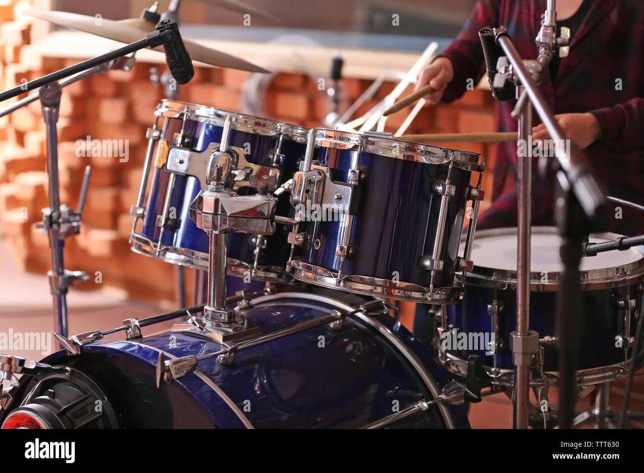 Woman playing drums in a recording studio Stock Photo - Alamy