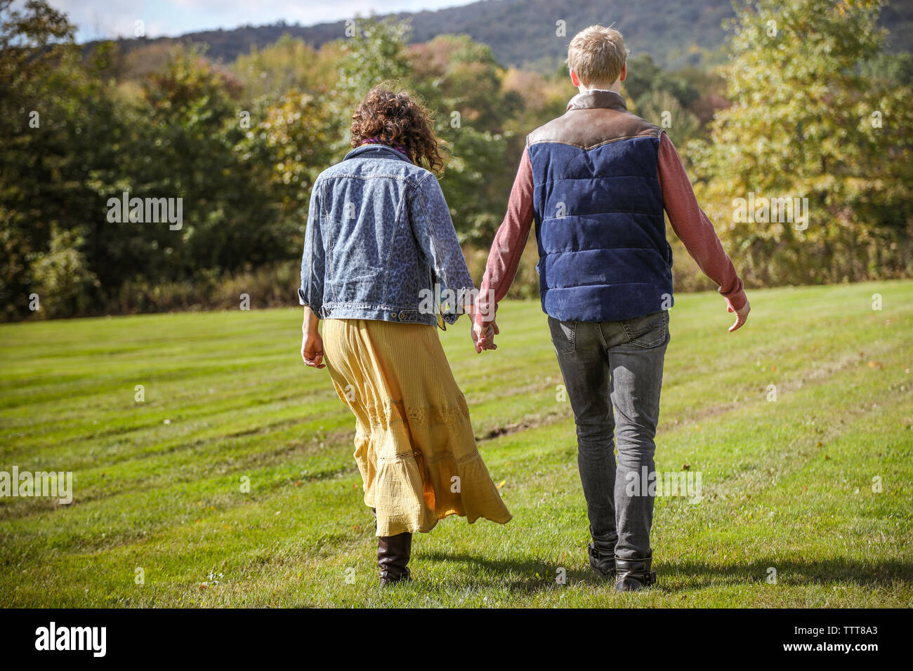 Old couple holding hands from distance hi-res stock photography and ...
