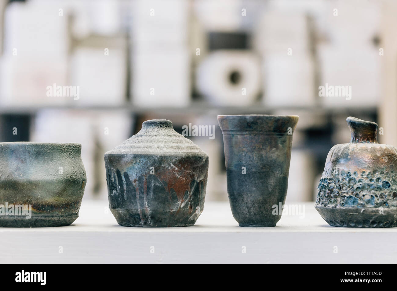 Close-up of earthenware on table at workshop Stock Photo