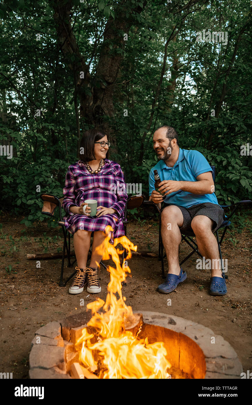 Couple sitting on camping chairs hi-res stock photography and images ...