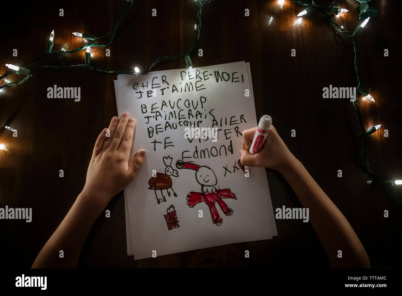 young boy faceless writing a letter to Santa Claus for Christmas Stock Photo
