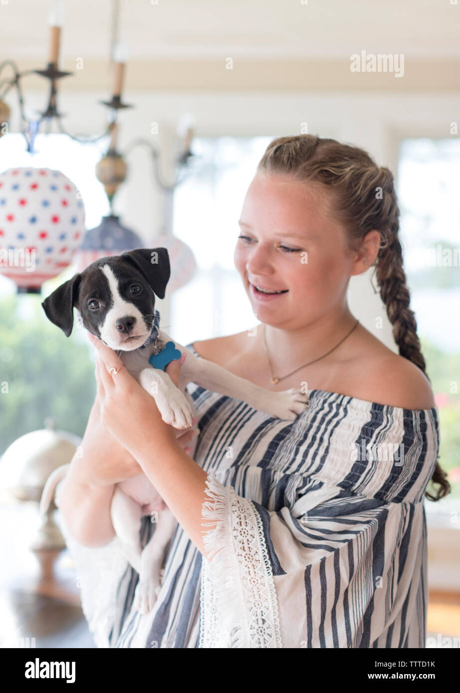young girl holding puppy Stock Photo