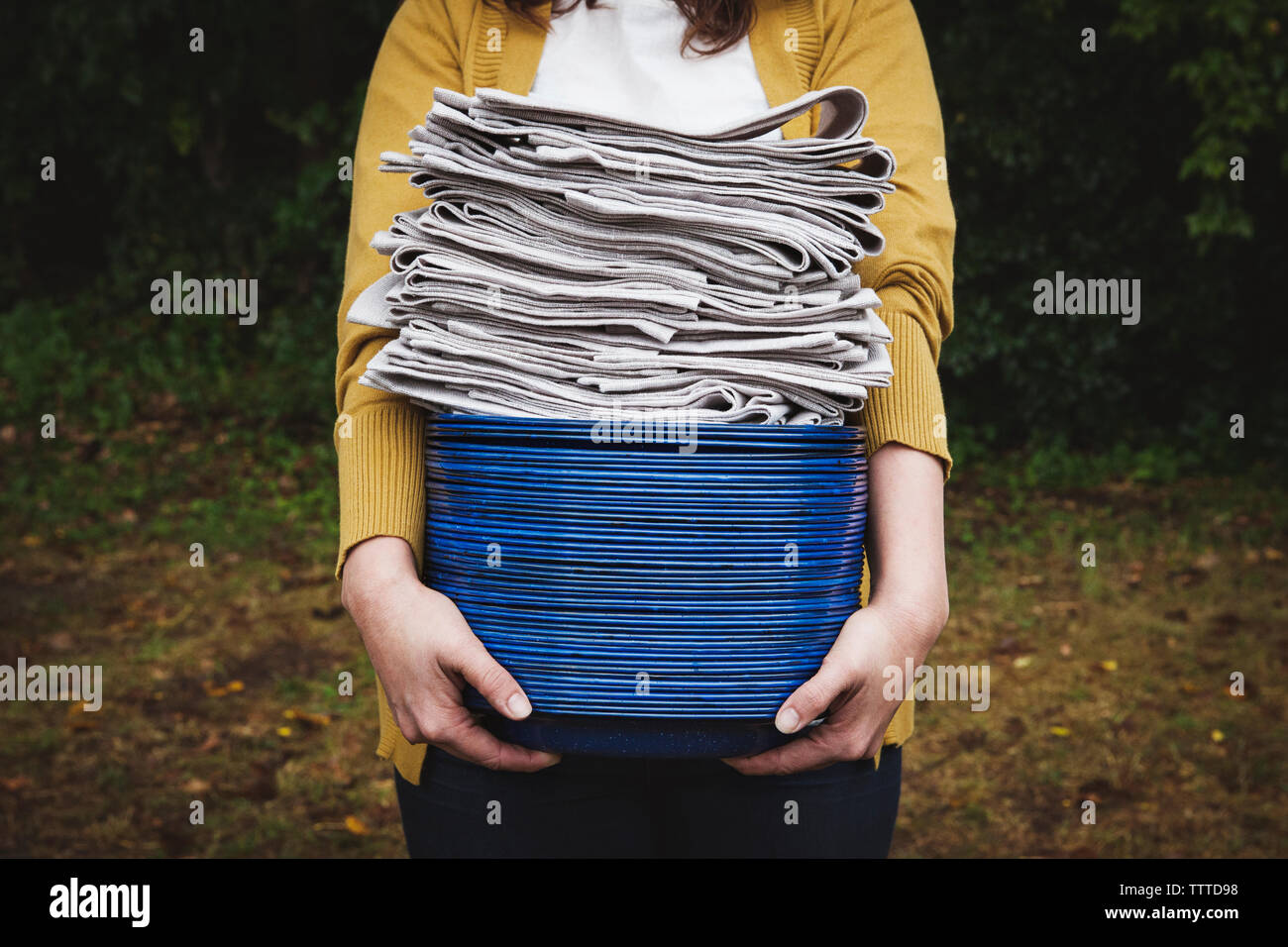 Person carrying stacked plates hi-res stock photography and images - Alamy