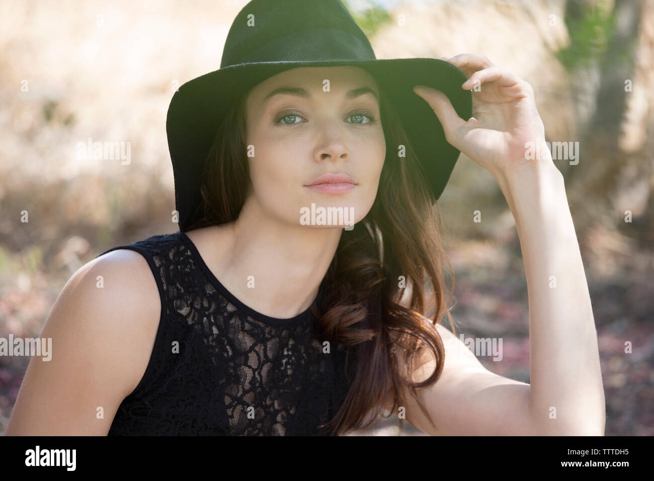 Woman wearing black hat hi-res stock photography and images - Alamy