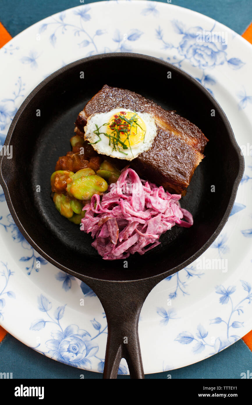 BERMUDA. Hamilton. Hamilton Princess & Beach Club hotel. Marcus' Restaurant. Chef Marcus Samuelsson's Jerk Pork Belly dish with Island quail egg and s Stock Photo