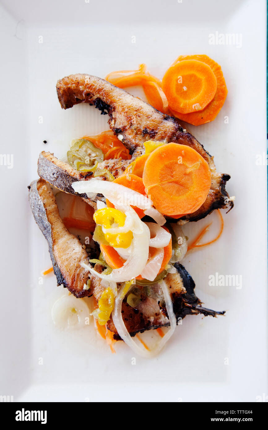 JAMAICA, Oracabessa. Goldeneye Hotel and Resort. Fried fish with pickled vegetables at the