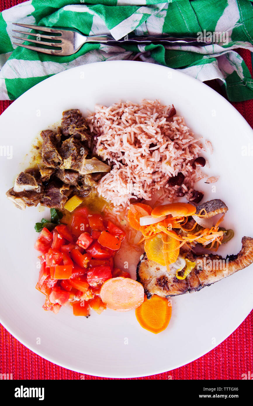 JAMAICA, Oracabessa. Goldeneye Hotel and Resort. Goat Curry, Rice, and Fried fish with pickled