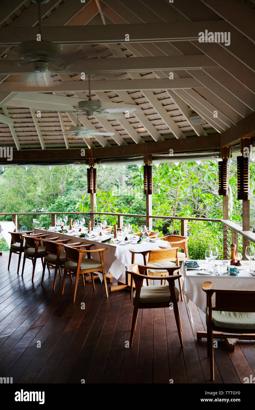 JAMAICA, Oracabessa. Goldeneye Hotel and Resort. A dining table ready