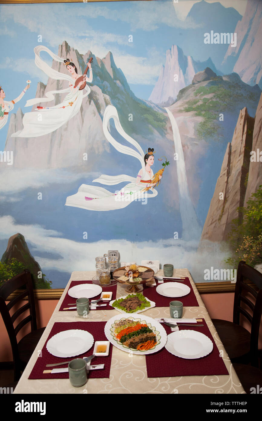 RUSSIA, Moscow. Table with food at Koryo, a North Korean restaurant in Moscow. Stock Photo