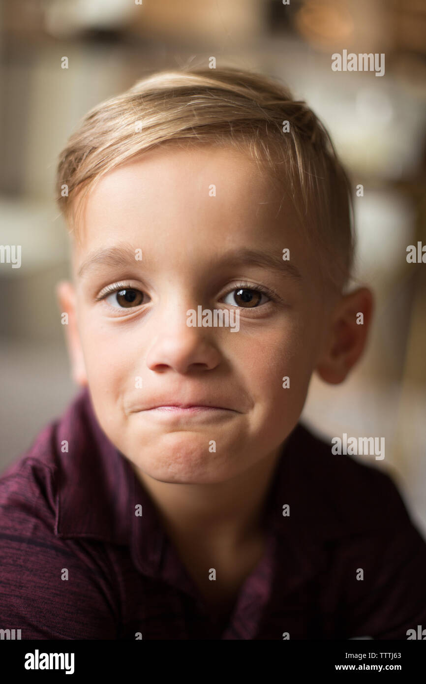 Big, brown eyed boy has a determined, sweet expression and face. Stock Photo