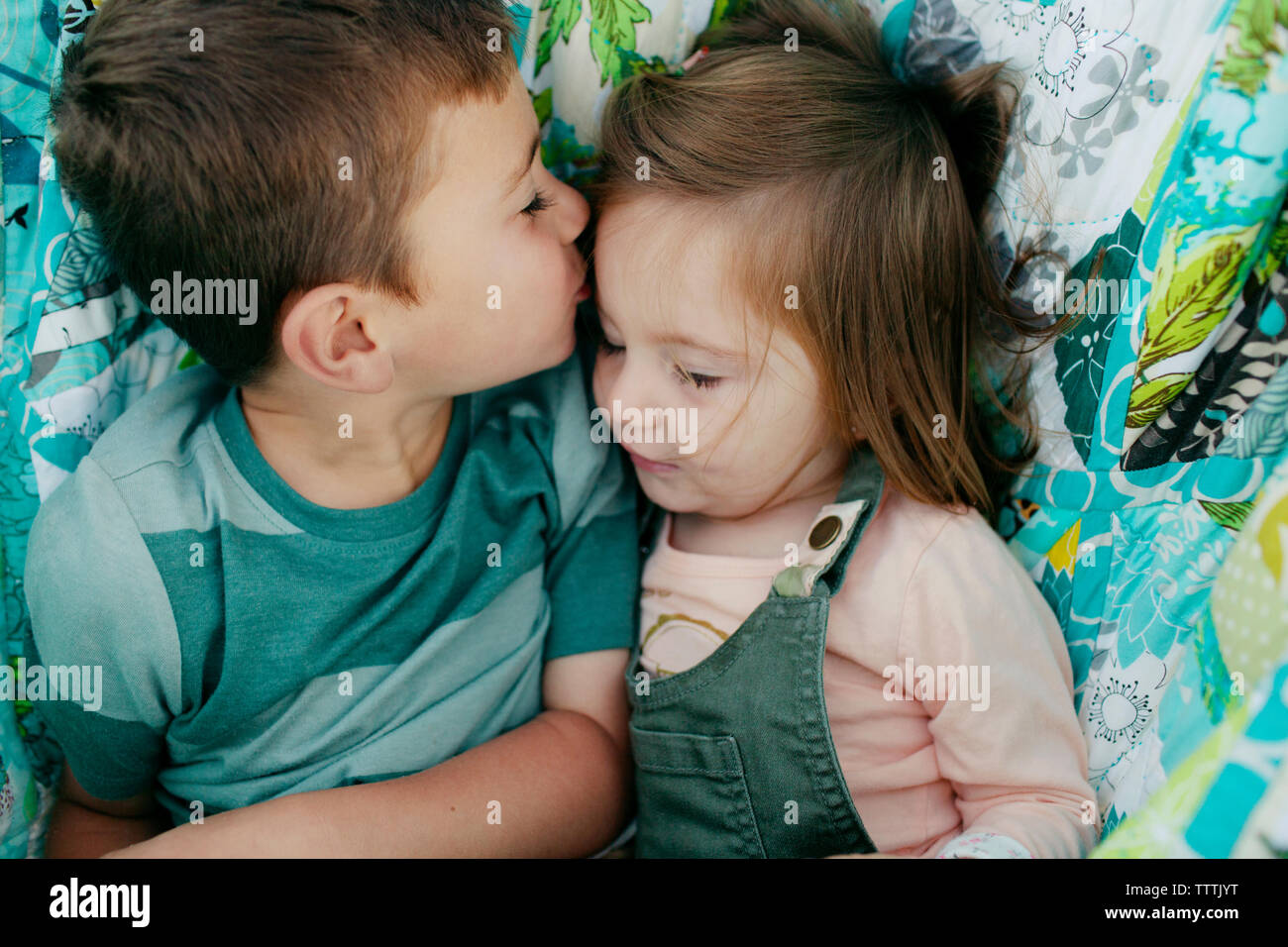 Boy and girl kissing boy hi-res stock photography and images - Alamy