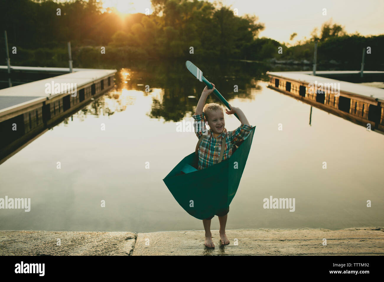 Happy boy and boat hi-res stock photography and images - Alamy