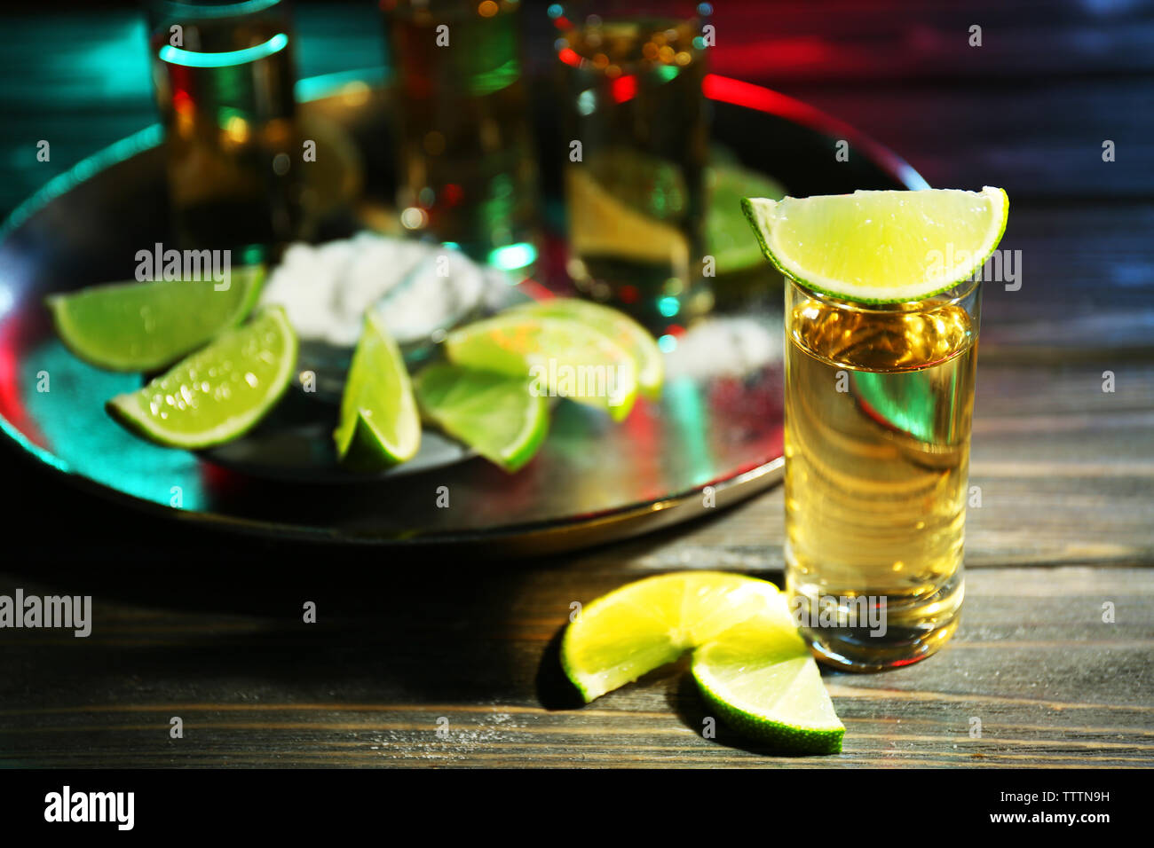 Gold tequila shot with lime in bar Stock Photo - Alamy, image size:1300x956