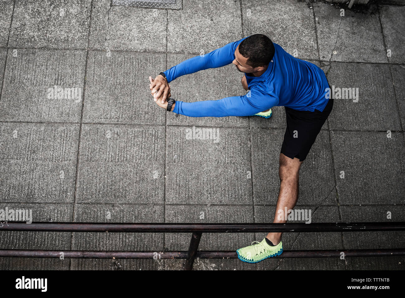 High angle view of man exercising on street Stock Photo
