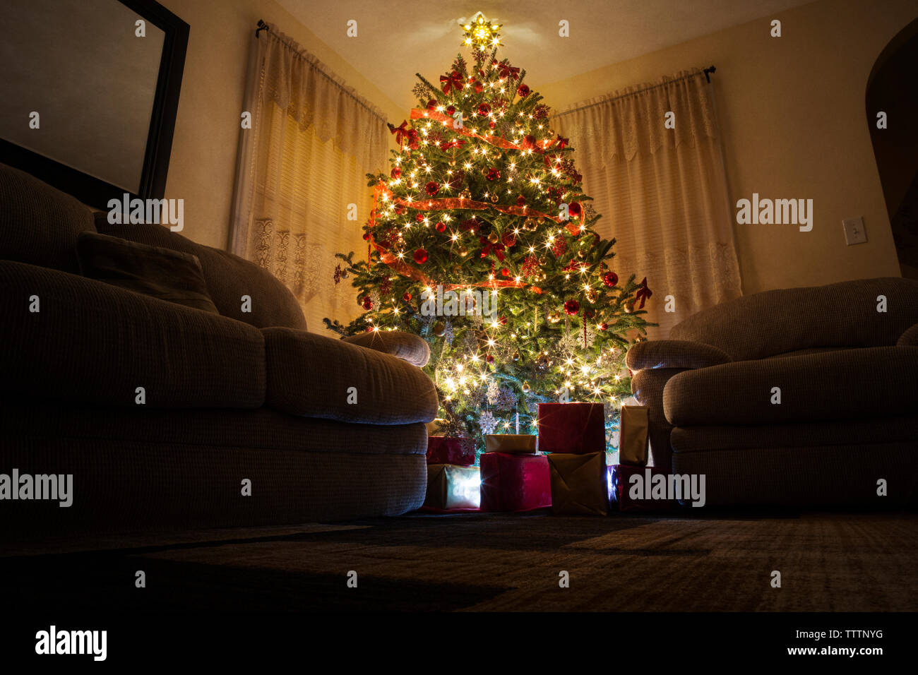 Low angel view of illuminated Christmas tree at home Stock Photo