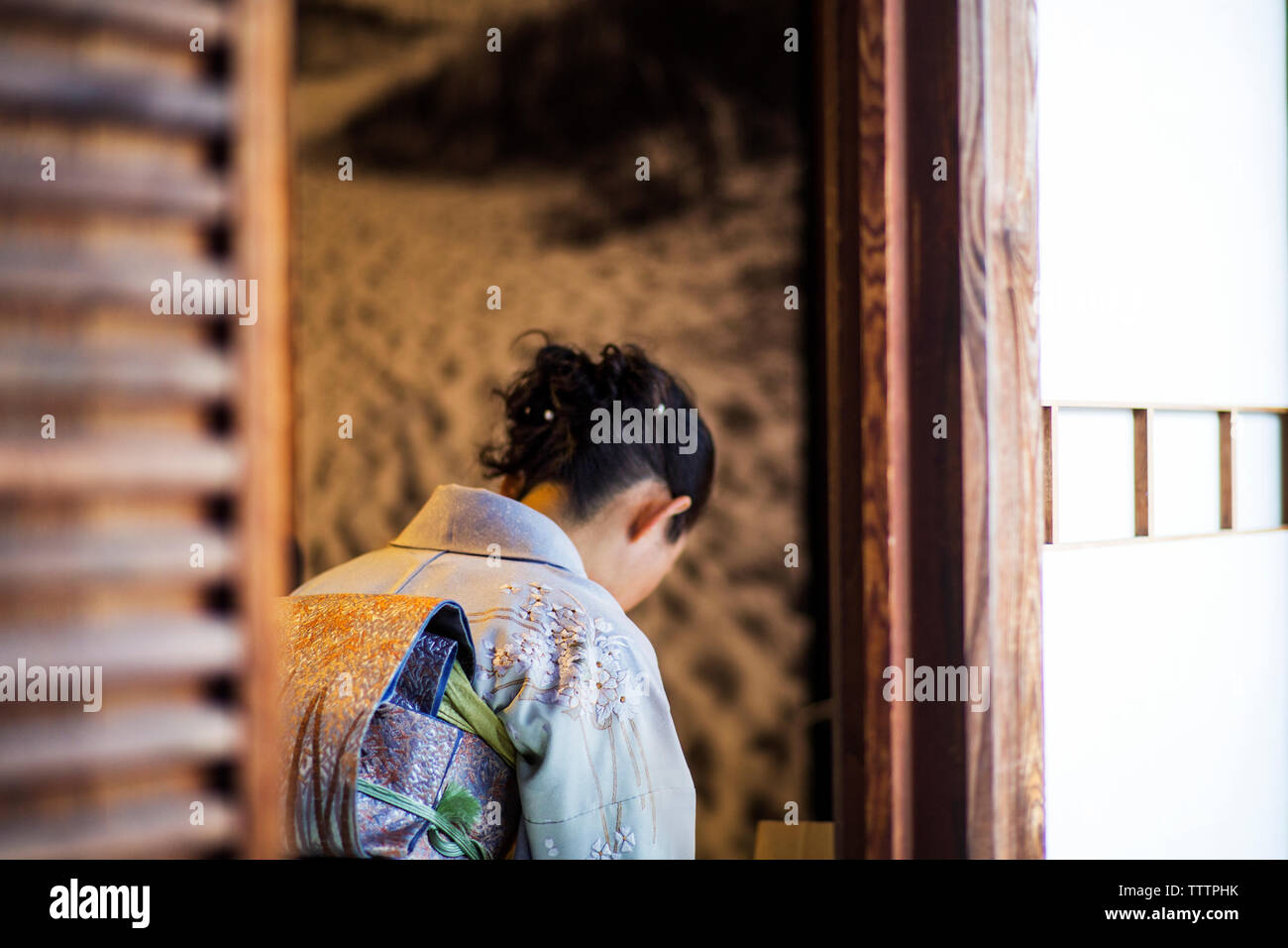 Woman praying in Japanese temple Stock Photo - Alamy