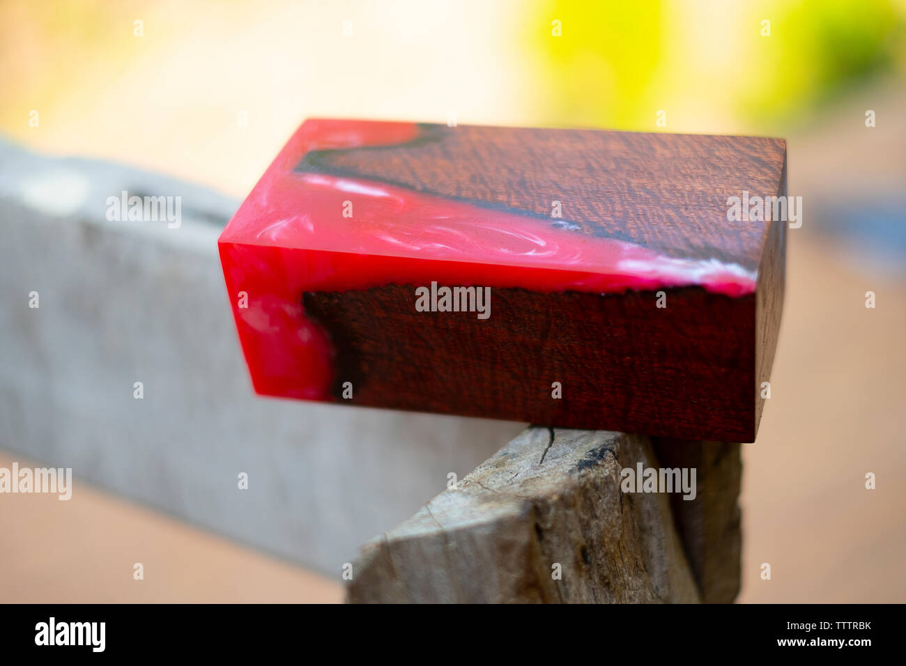 Casting epoxy resin stabilizing wood has tiger stripe red color