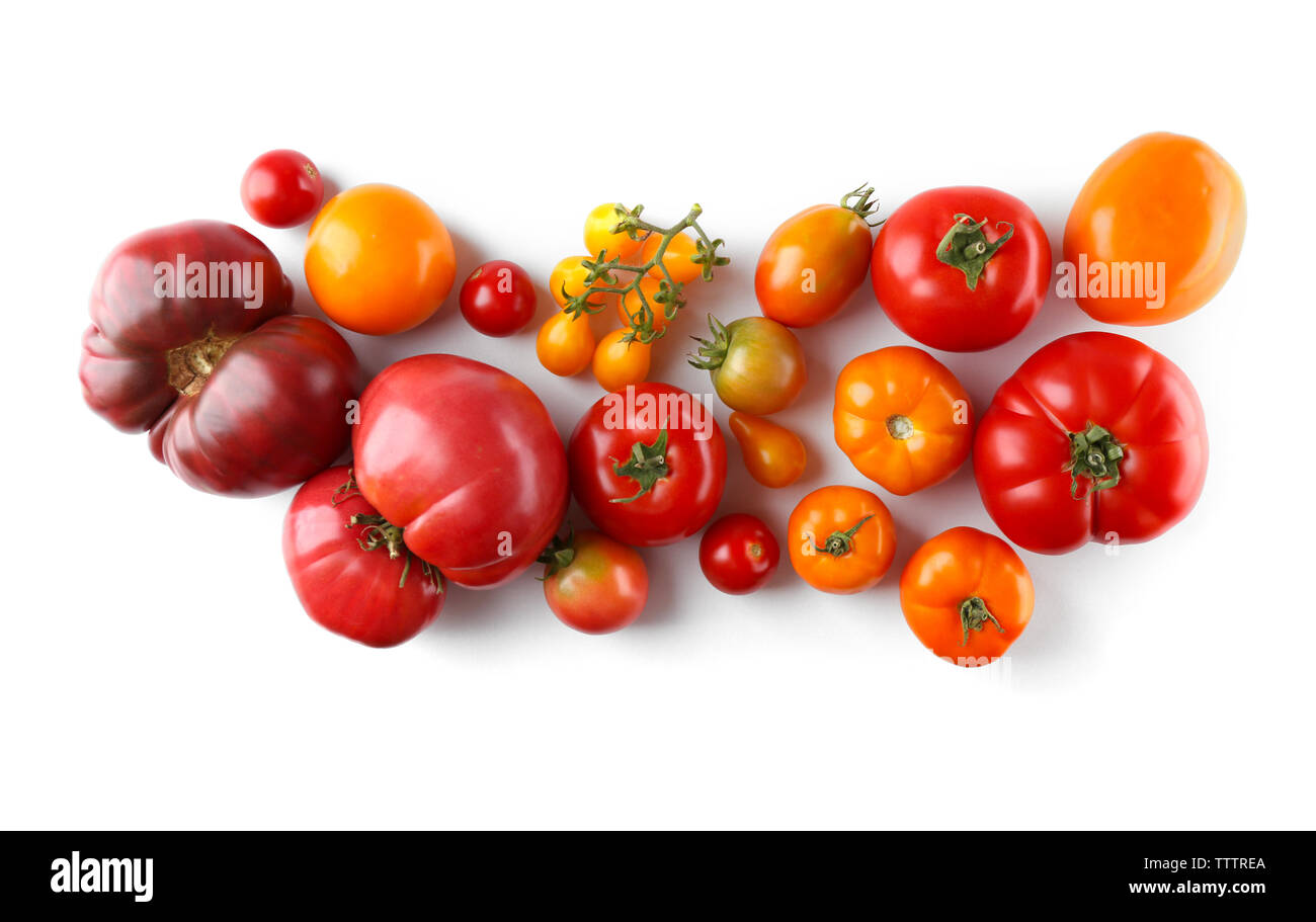 Composition of red and yellow tomatoes on white background Stock Photo ...