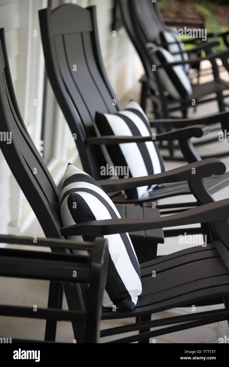 Black rocking chairs on the front porch of the 1909 neoclassical Charters-Smith House on historic Green Street in Gainesville, Georgia. (USA) Stock Photo