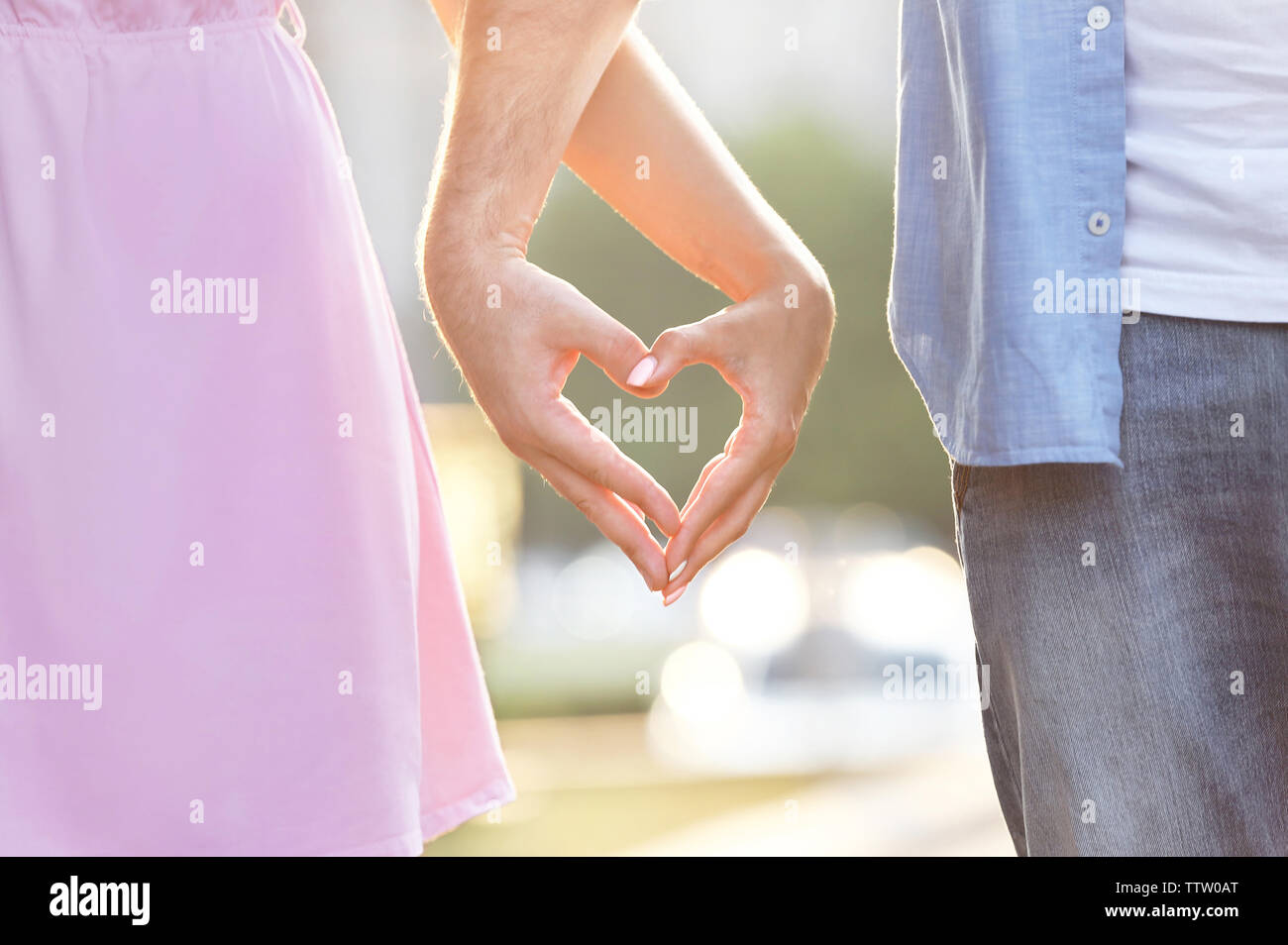 Couple make heart shape with hands hi-res stock photography and images ...