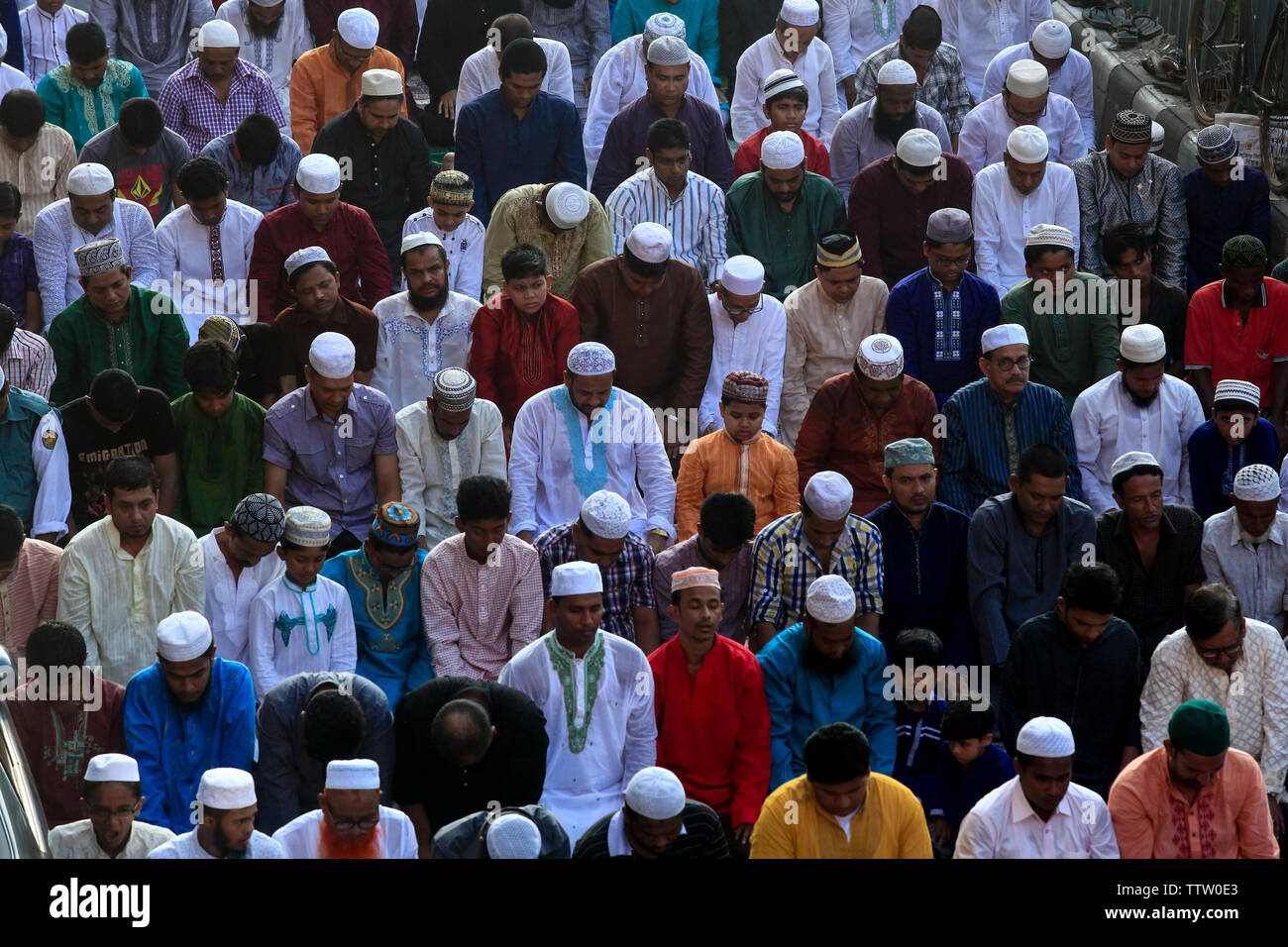 People join Eid-ul-Azha prayers on the road outside of Baitul Mukarram National Mosque in Dhaka. Eid-ul-Azha, on of the mail religious festival of the Stock Photo