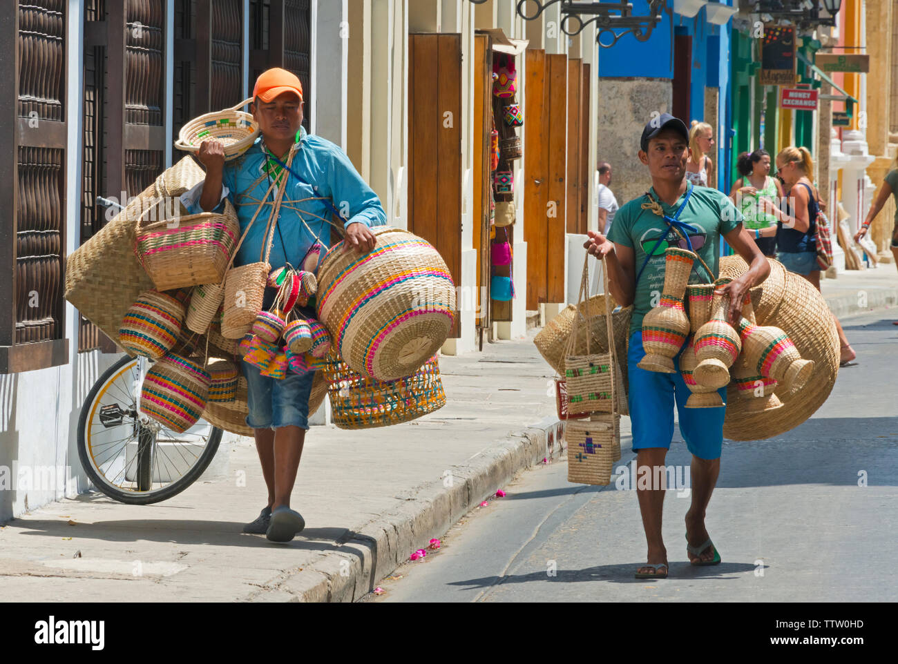 Vendors carrying basket on the street of the old town, Cartagena, UNESCO World Heritage site, Bolivar Department, Colombia Stock Photo