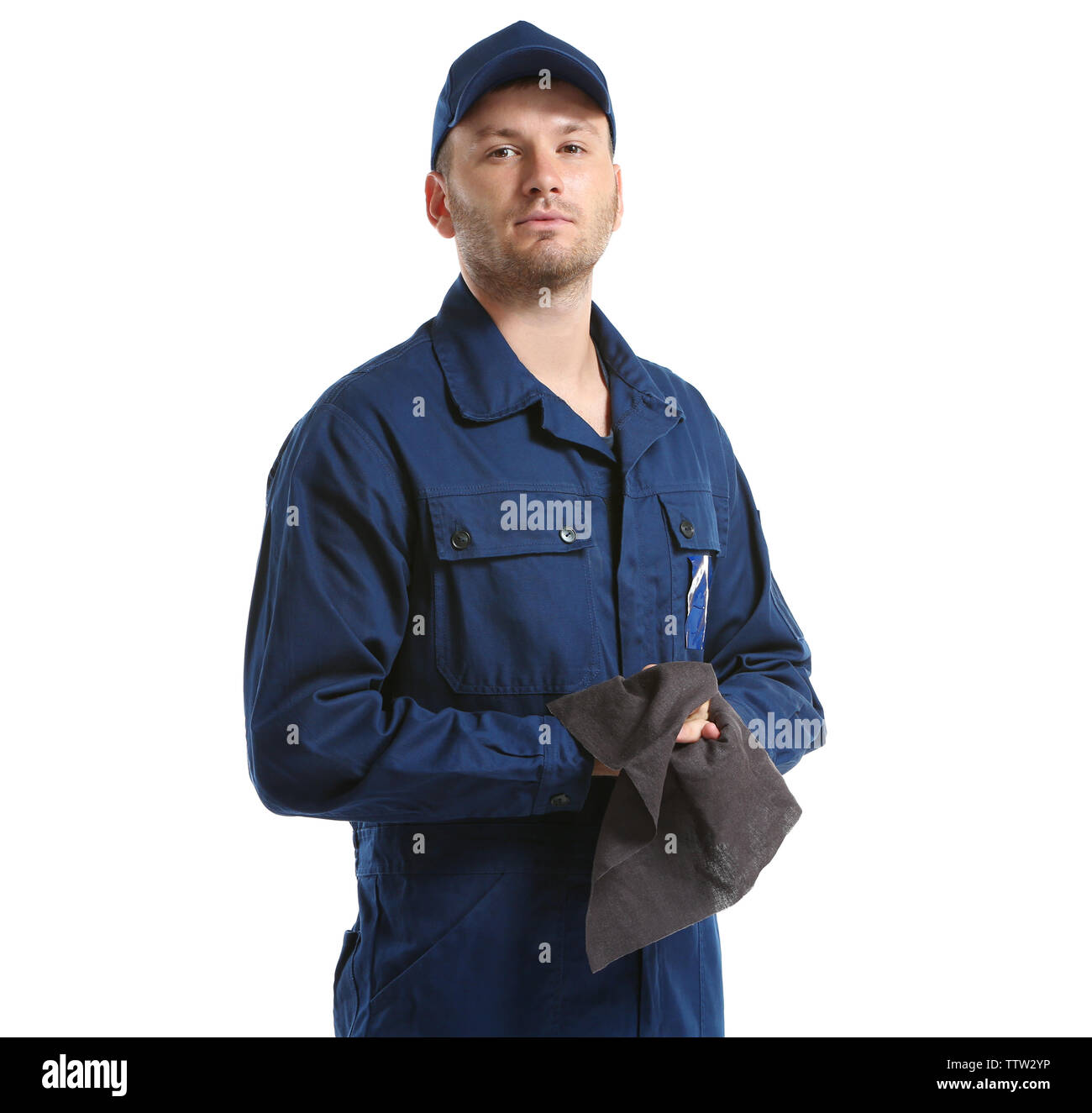 Young mechanic in uniform with rag standing, isolated on white Stock ...