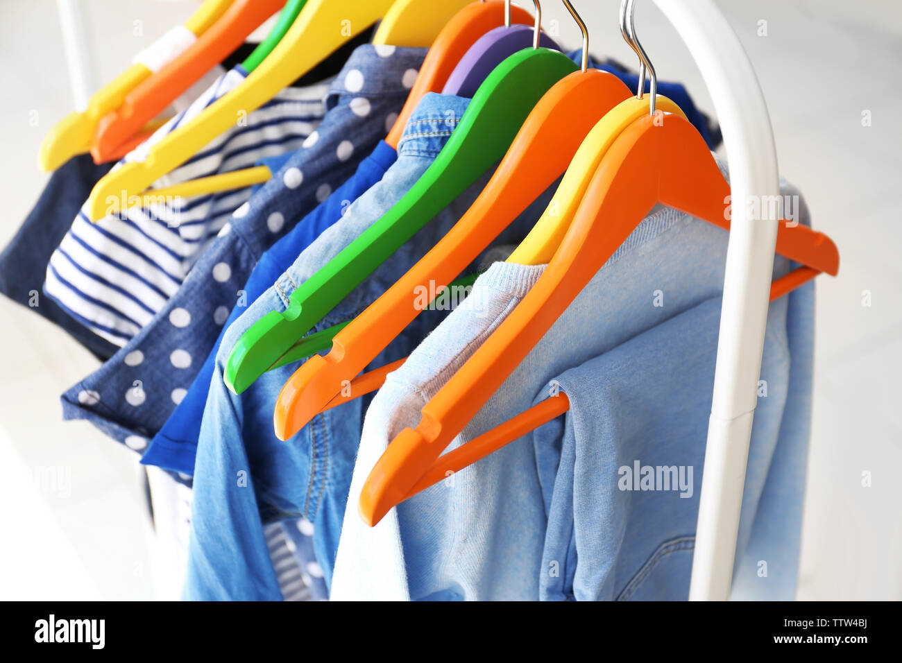 Clothes hanging on rack, closeup Stock Photo Alamy