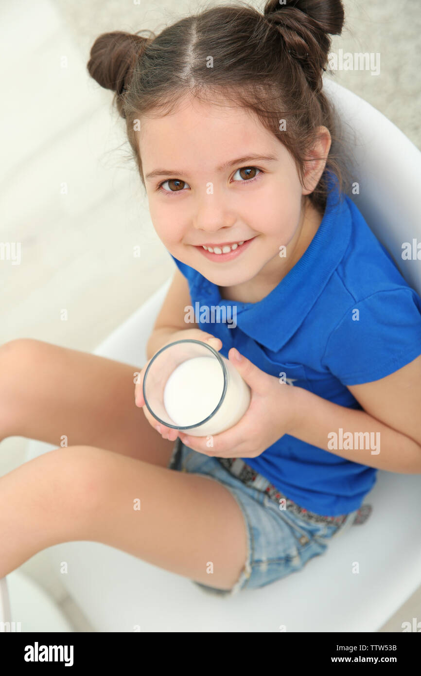 Little girl sitting on chair hires stock photography and images Alamy