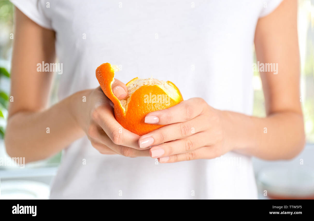 Closeup hands peeling orange fruit hi-res stock photography and images ...