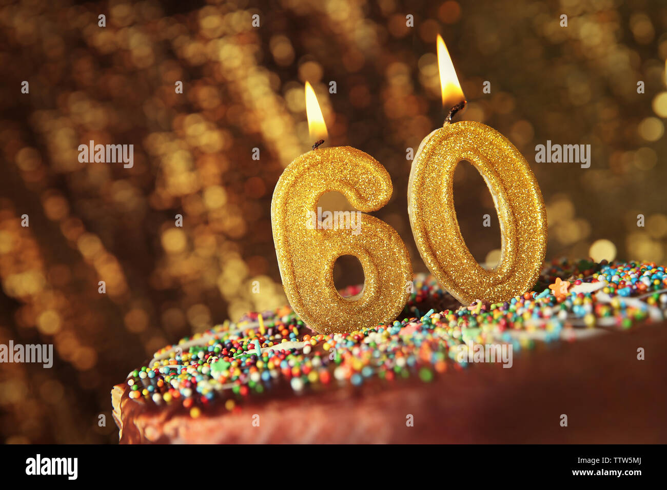 Birthday cake with burning candles on blurred background Stock Photo ...
