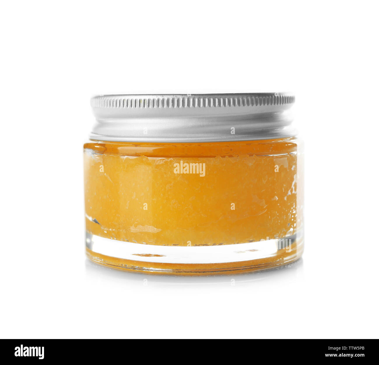 Glass jar with orange scrub isolated on white Stock Photo - Alamy