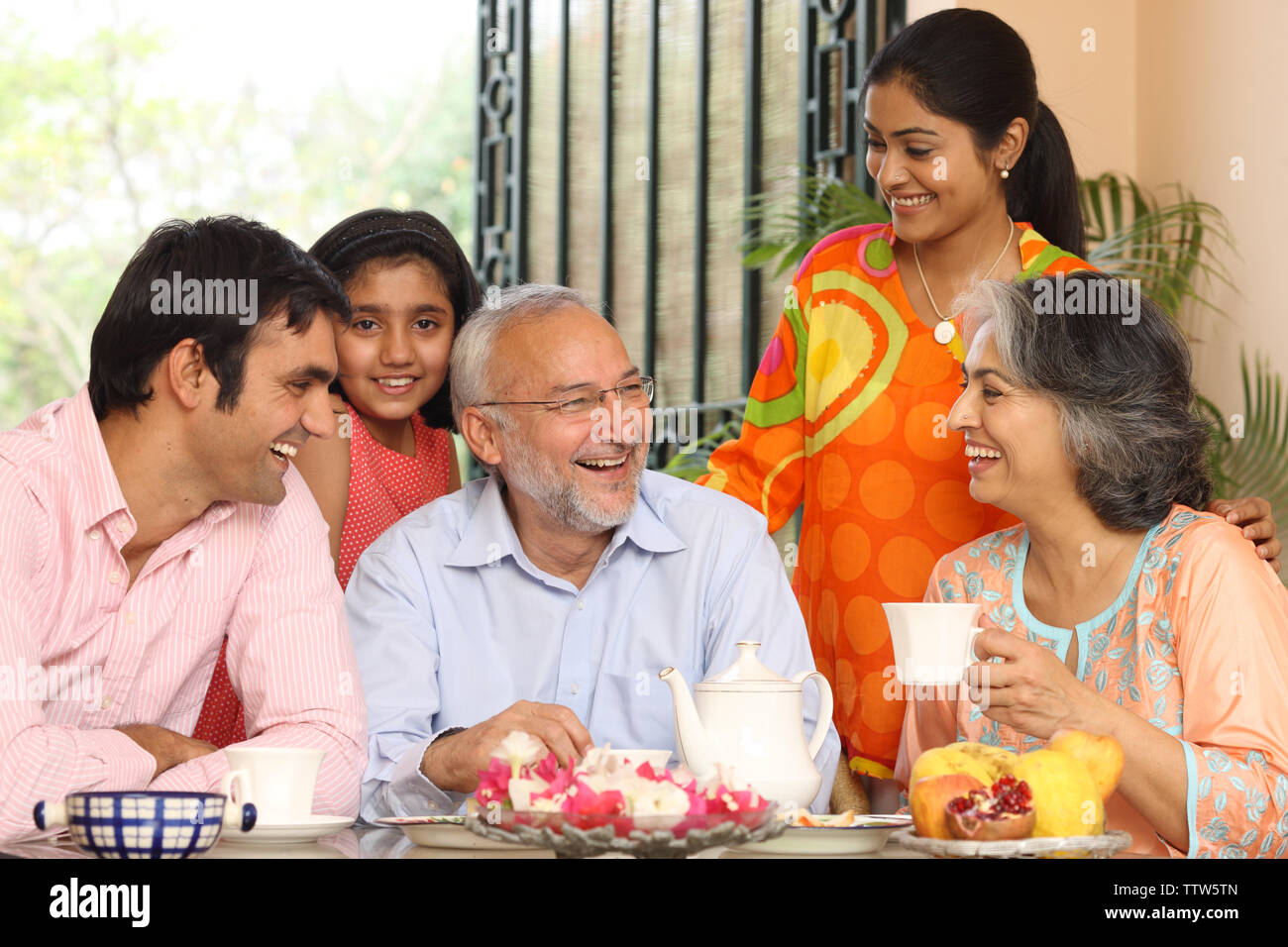 Family at a breakfast table Stock Photo - Alamy