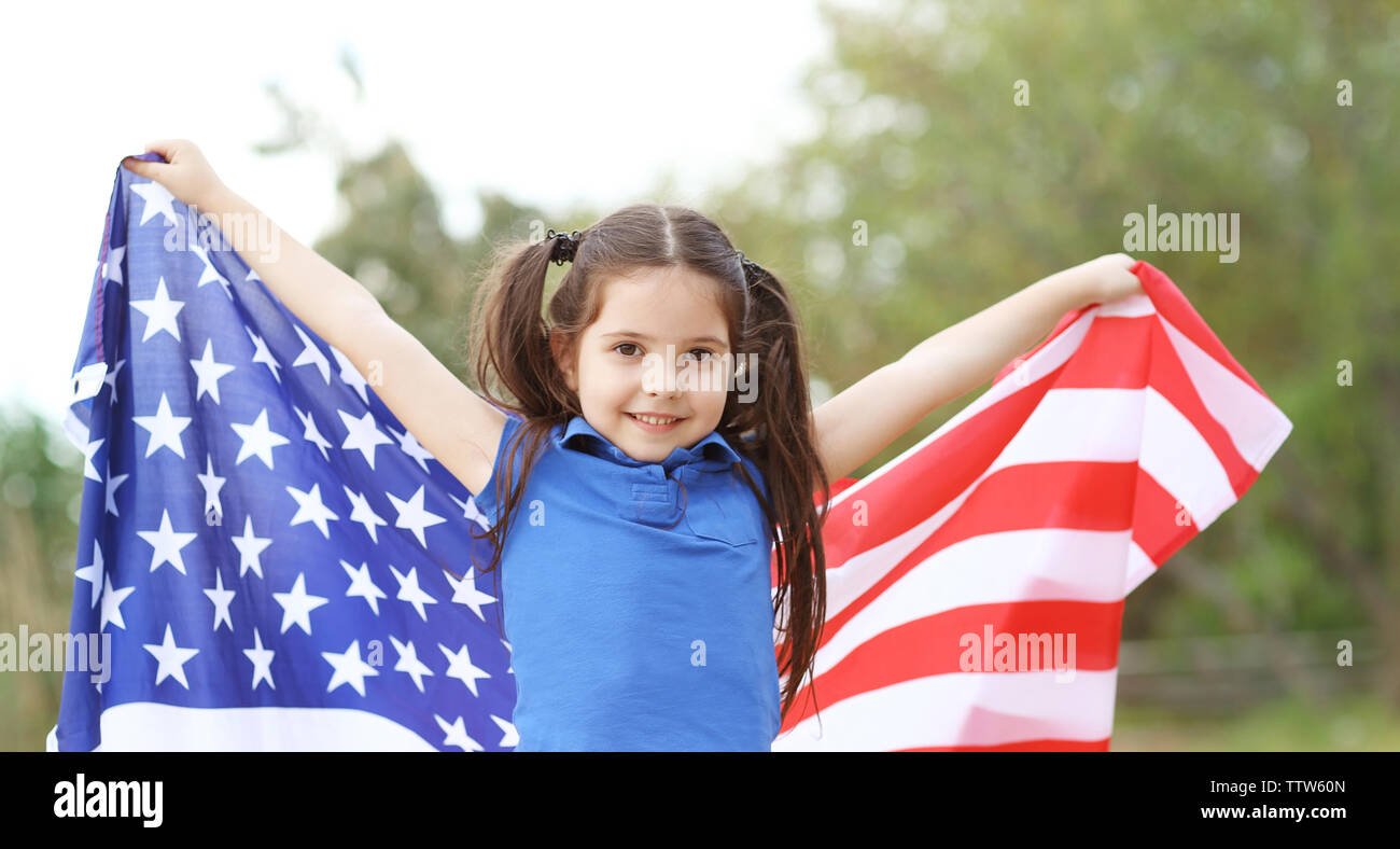 Cute little girl with USA flag in park Stock Photo - Alamy