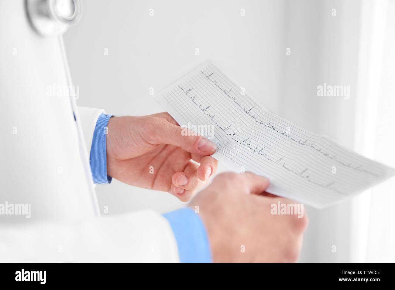 male doctor hands holding cardiogram Stock Photo - Alamy