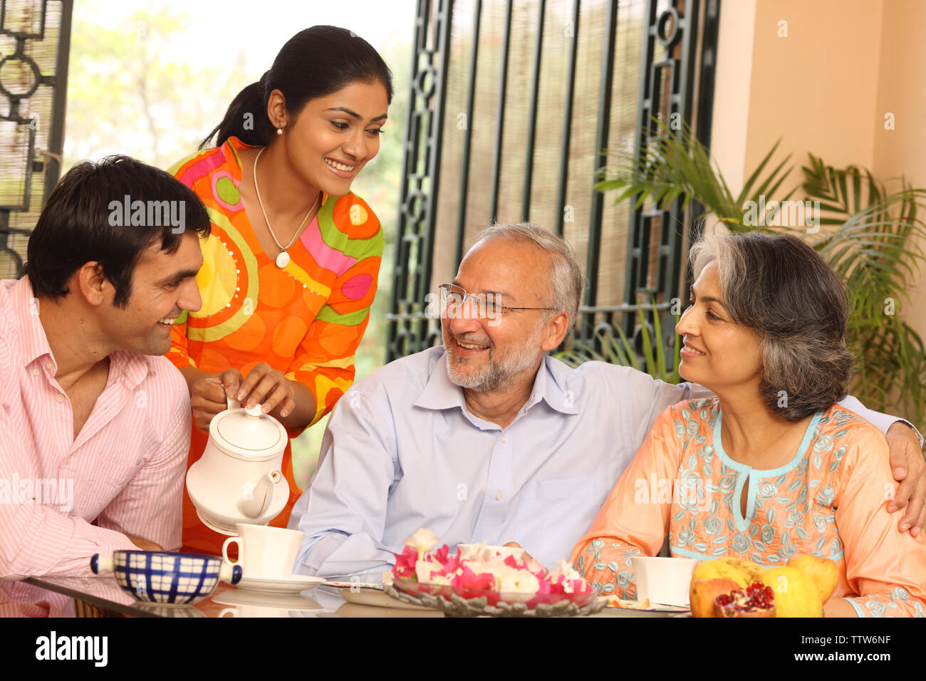Family at a breakfast table Stock Photo - Alamy