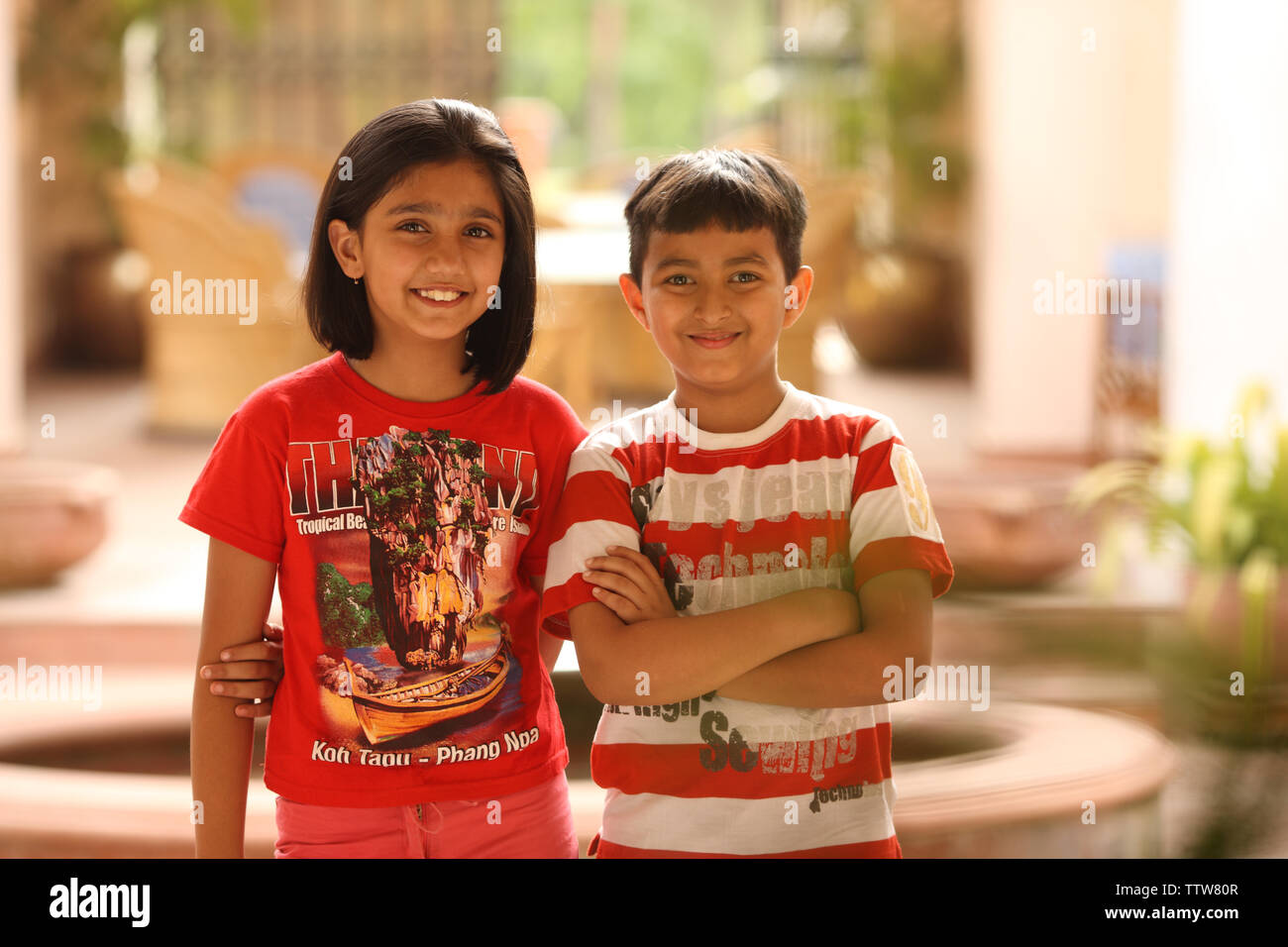 Portrait of a boy and a girl standing together Stock Photo - Alamy