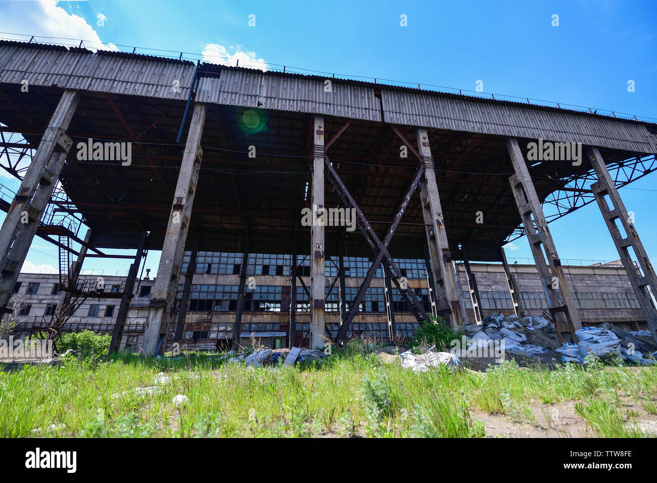 View of an abandoned factory, warehouse in an industrial area. Horizontal photography Stock Photo