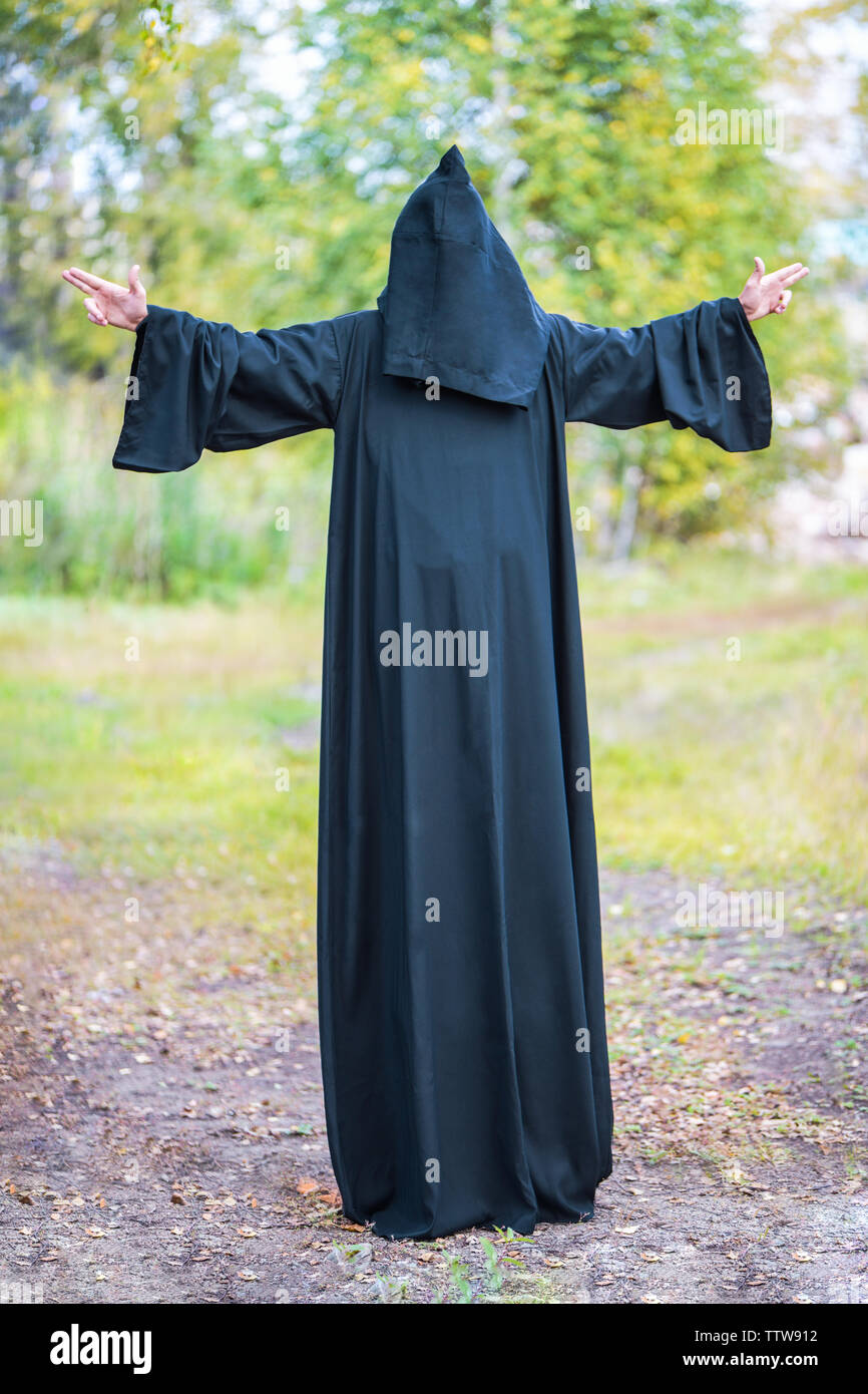 Man in black cloak with hood hires stock photography and images Alamy