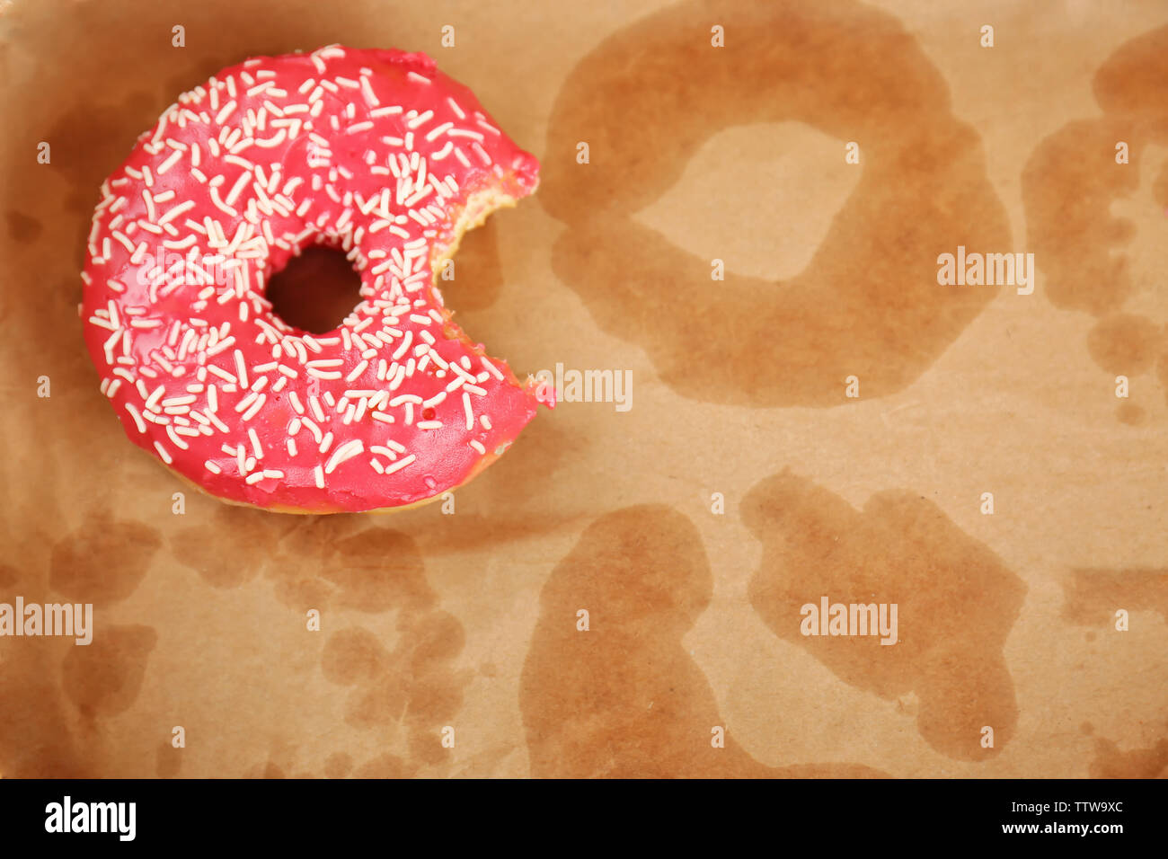 Delicious donut on greasy paper Stock Photo Alamy