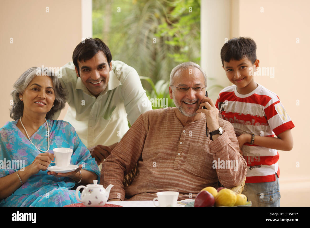 Family at a breakfast table Stock Photo - Alamy