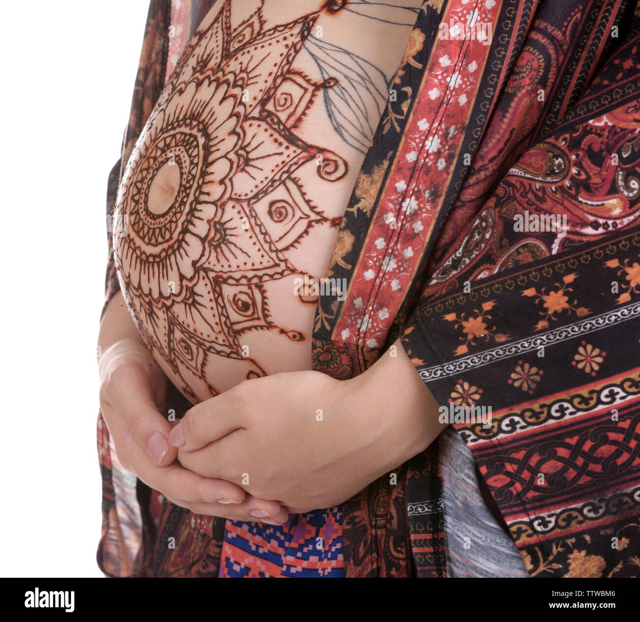 Harmless henna floral drawing art on boho pregnant woman tummy