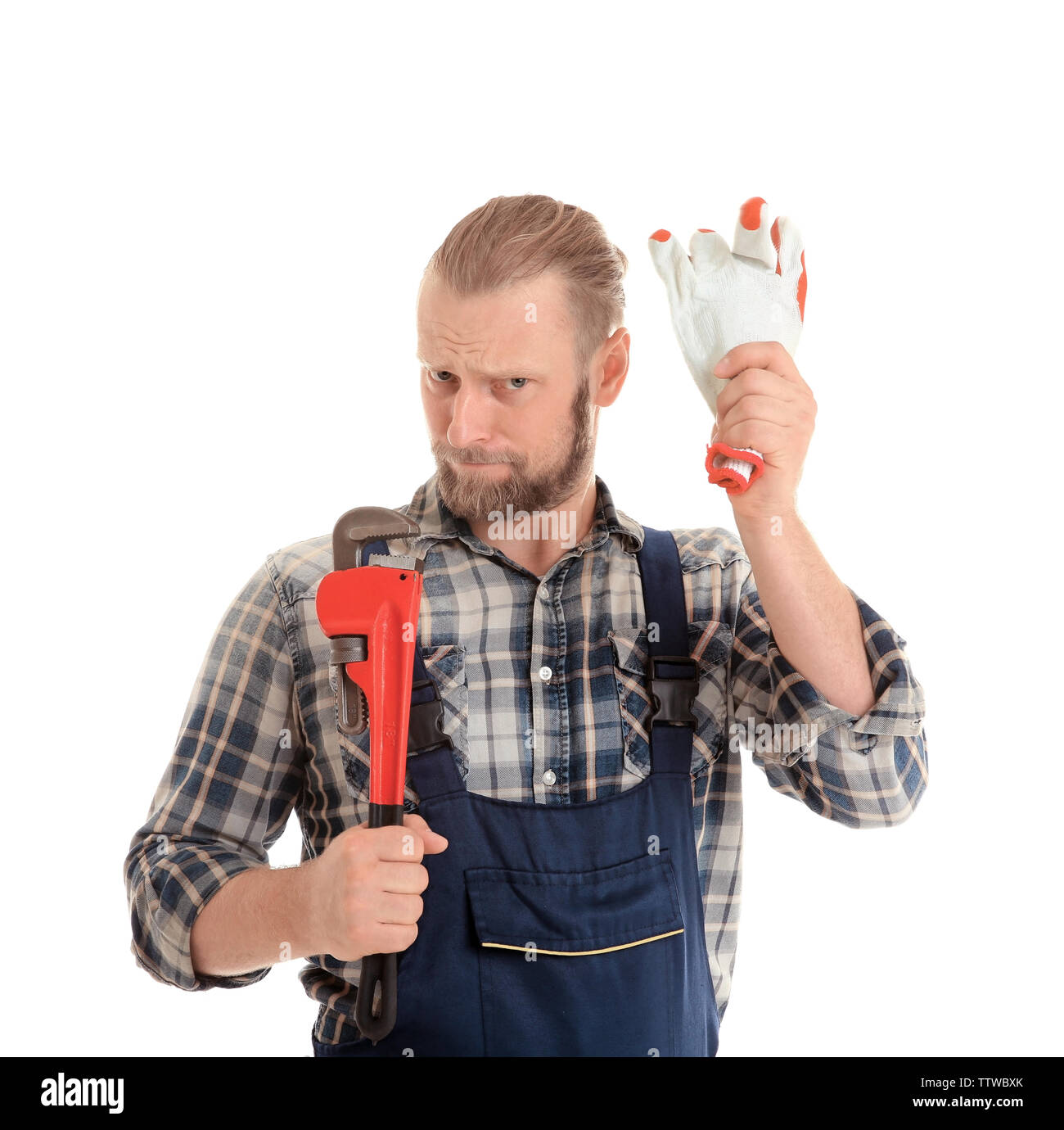 Portrait of funny plumber with pipe wrench and glove isolated on white ...
