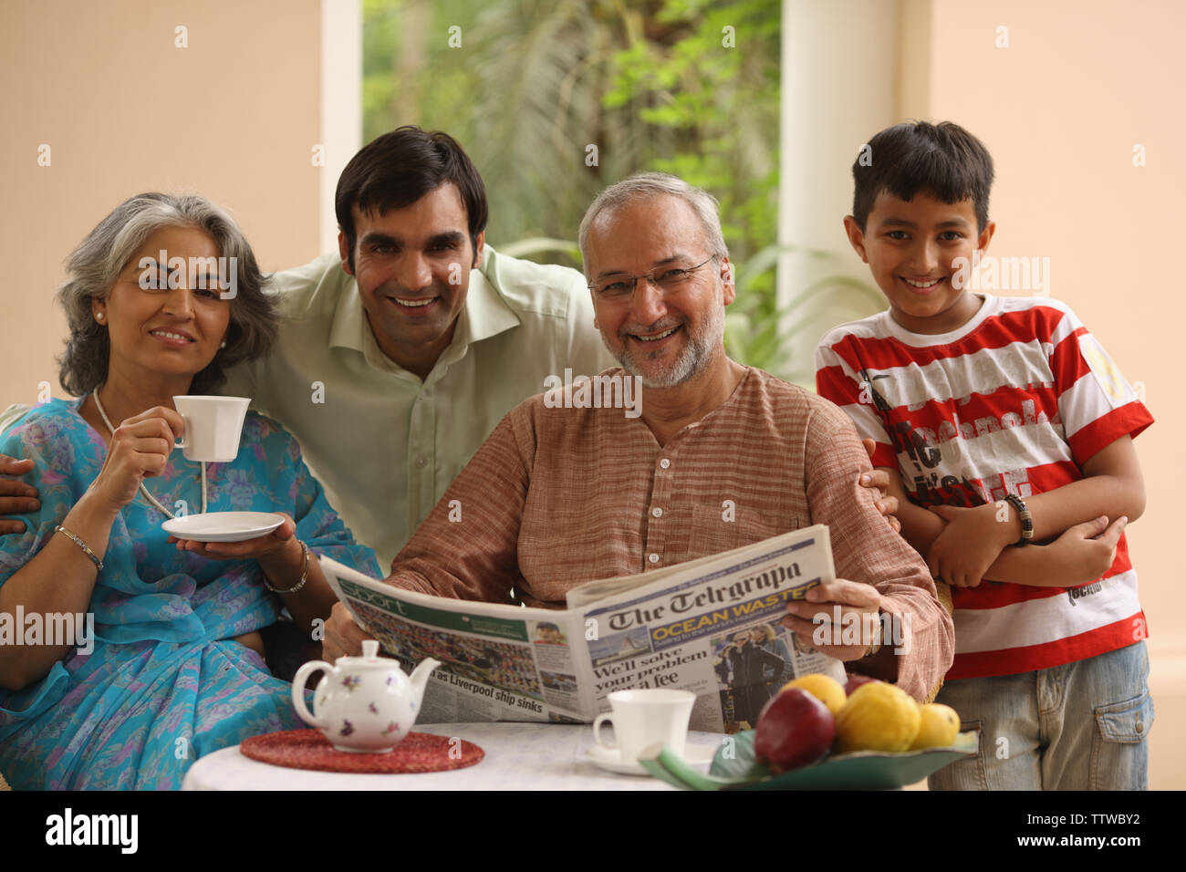 Family at a breakfast table Stock Photo - Alamy
