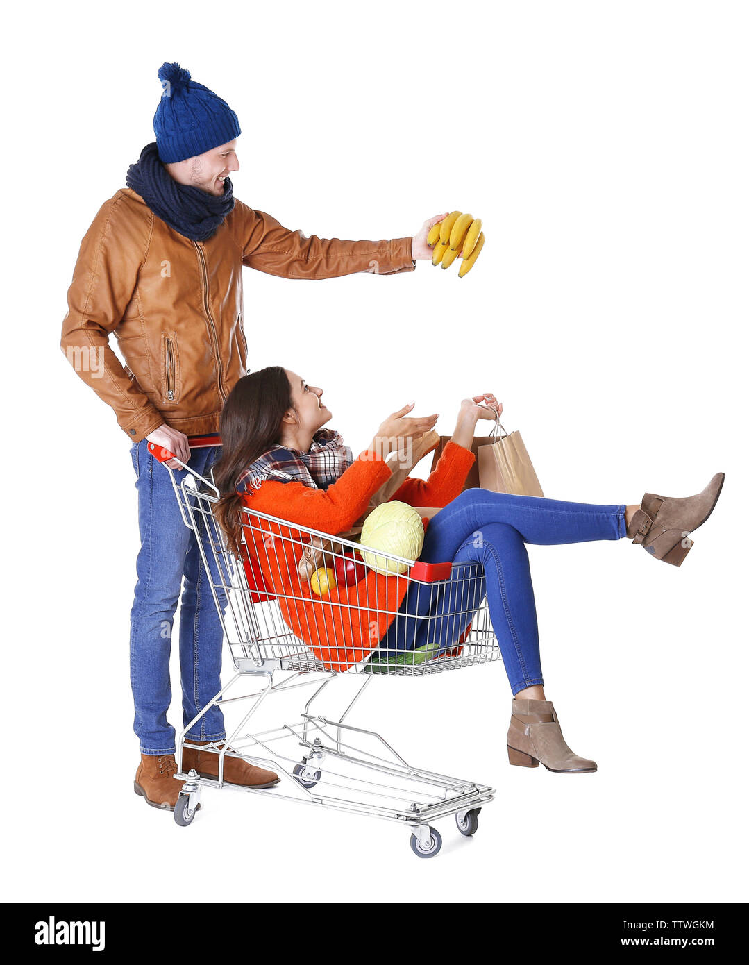 Young man carrying woman in trolley isolated on white Stock Photo - Alamy