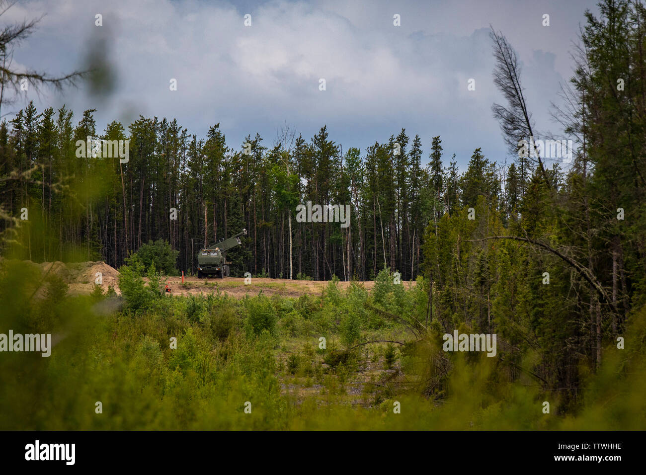 U.S. Marines with Fox Battery, 2nd Battalion, 14th Marine Regiment, 4th Marine Division, prepare to fire rockets from a High Mobility Artillery Rocket System during live-fire training at Cold Lake Air Weapons Range, Alberta, Canada, June 15, 2019, in support of Sentinel Edge 19. Training exercises, such as SE19, ensure Reserve Marines are proficient and capable of successful integration with active-duty Marines, making Marine Forces Reserve critical to the Marine Corps’ Total Force. (U.S. Marine Corps photo by Sgt. Andy O. Martinez) Stock Photo