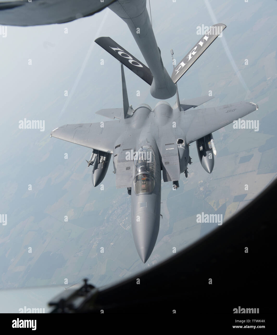 A U.S. Air Force KC-135 Stratotanker refuels an F-15E Strike Eagle assigned to the 492nd Fighter Squadron, RAF Lakenheath, in support of Exercise Baltic Operations, over Germany, June 12, 2019. BALTOPS is the premier annual maritime-focused exercise in the Baltic Region. (U.S. Air Force photo by Senior Airman Alexandria Lee) Stock Photo