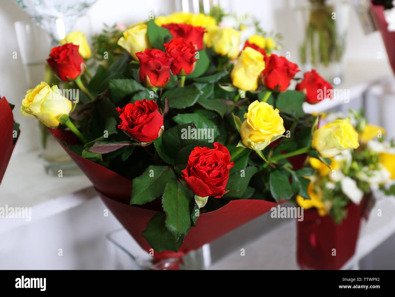 Beautiful bouquet of red and yellow roses at floral shop, closeup Stock ...