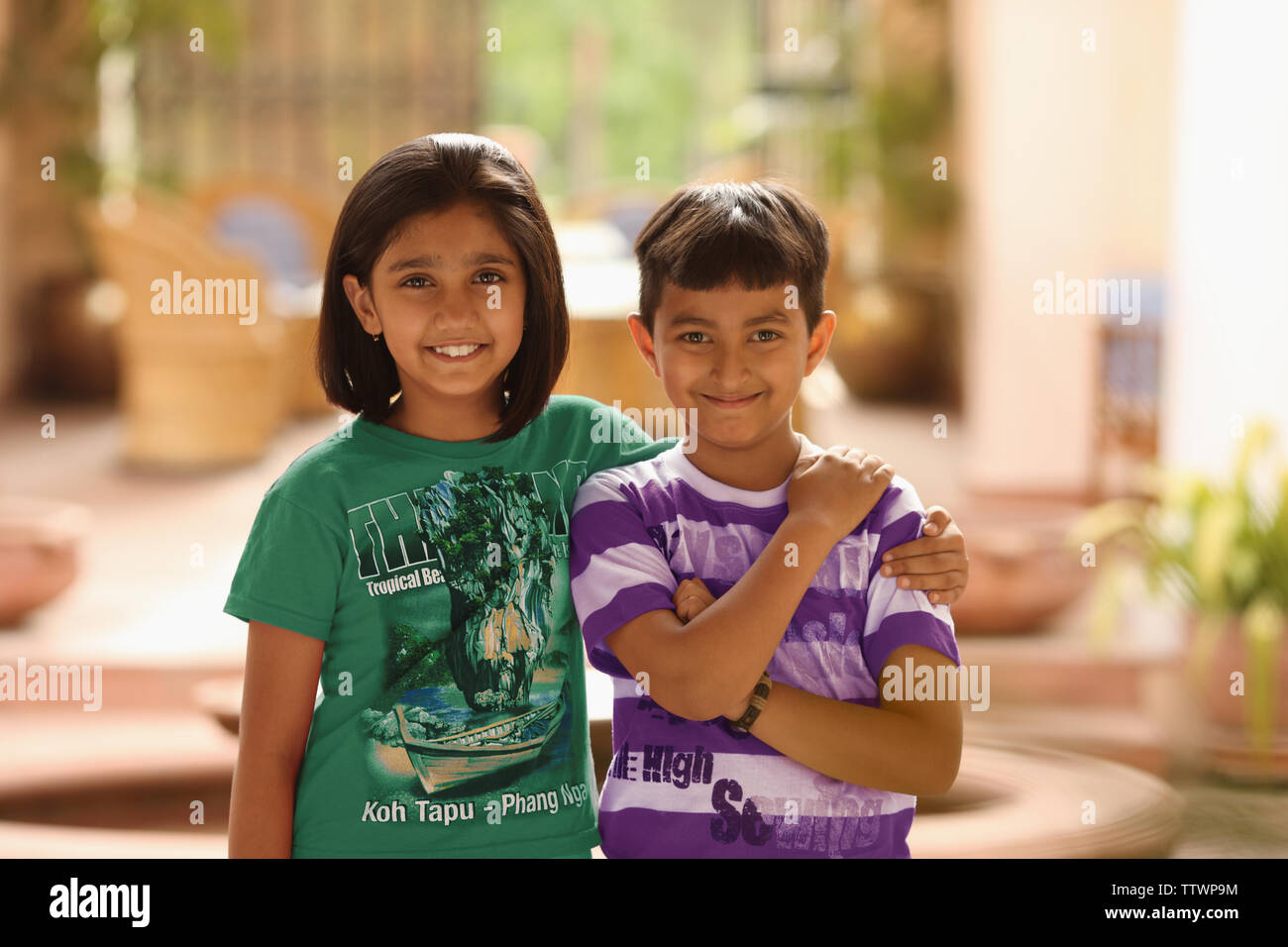 Portrait of a boy and a girl standing together Stock Photo - Alamy