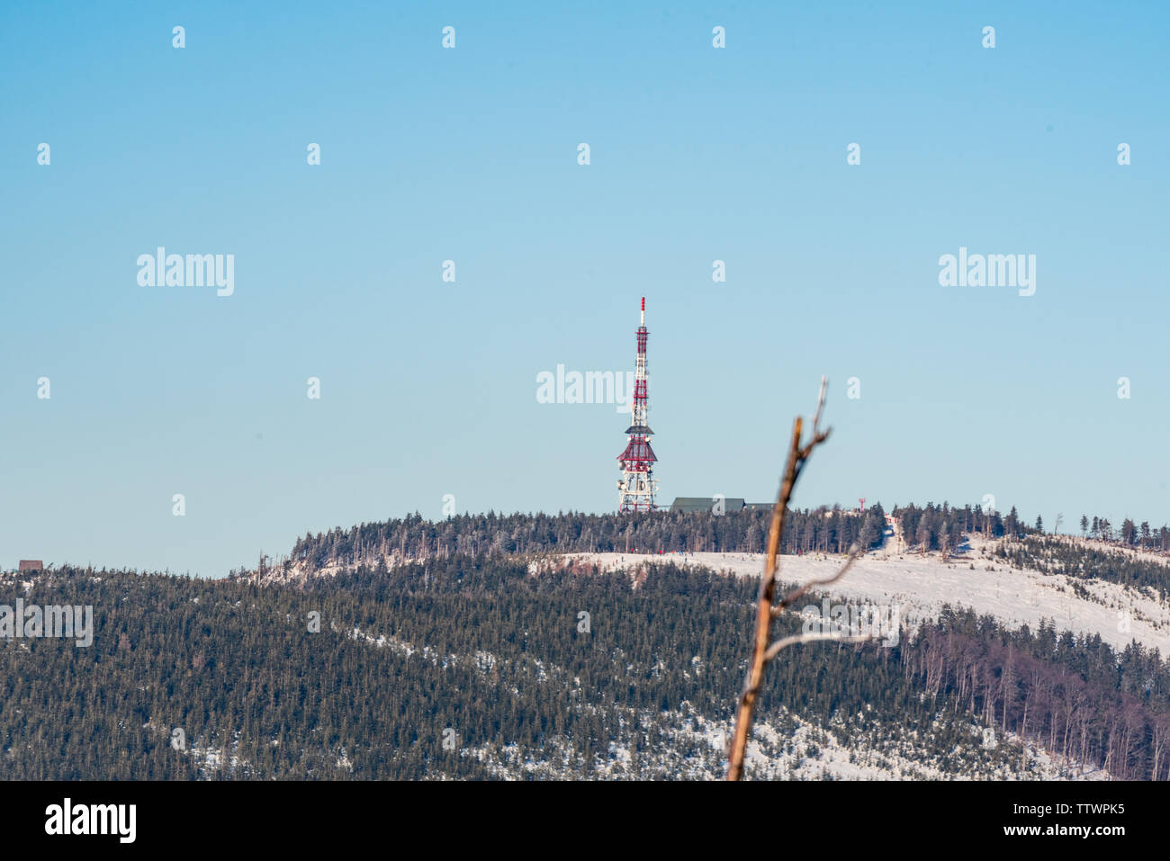 Skrzyczne hill with hut and communication tower from rock formation on Malinowska Skala hill in winter Beskid Slaski mountains in Poland Stock Photo